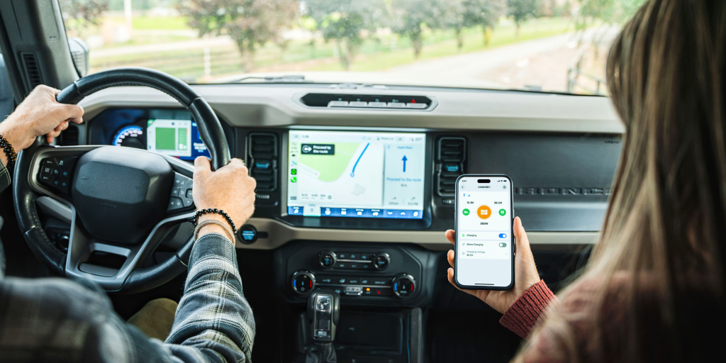 Passenger viewing the BLUETTI Charger 1 app inside a vehicle
