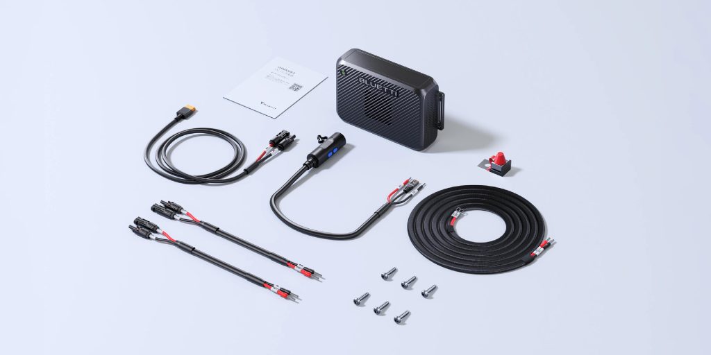 Charger 2 with cables, fuse, mounting hardware and paperwork laid out