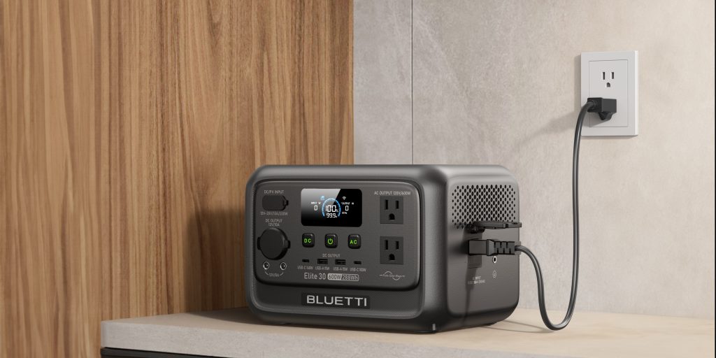 Gray Elite 30 V2 connected to a US wall outlet through its side AC input