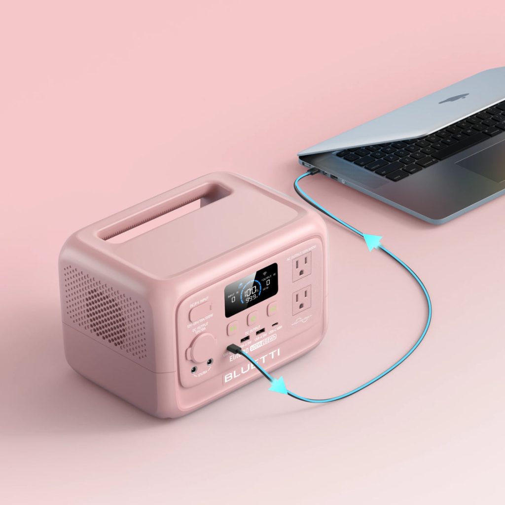 Pink Elite 30 V2 charging a laptop through a USB-C cable