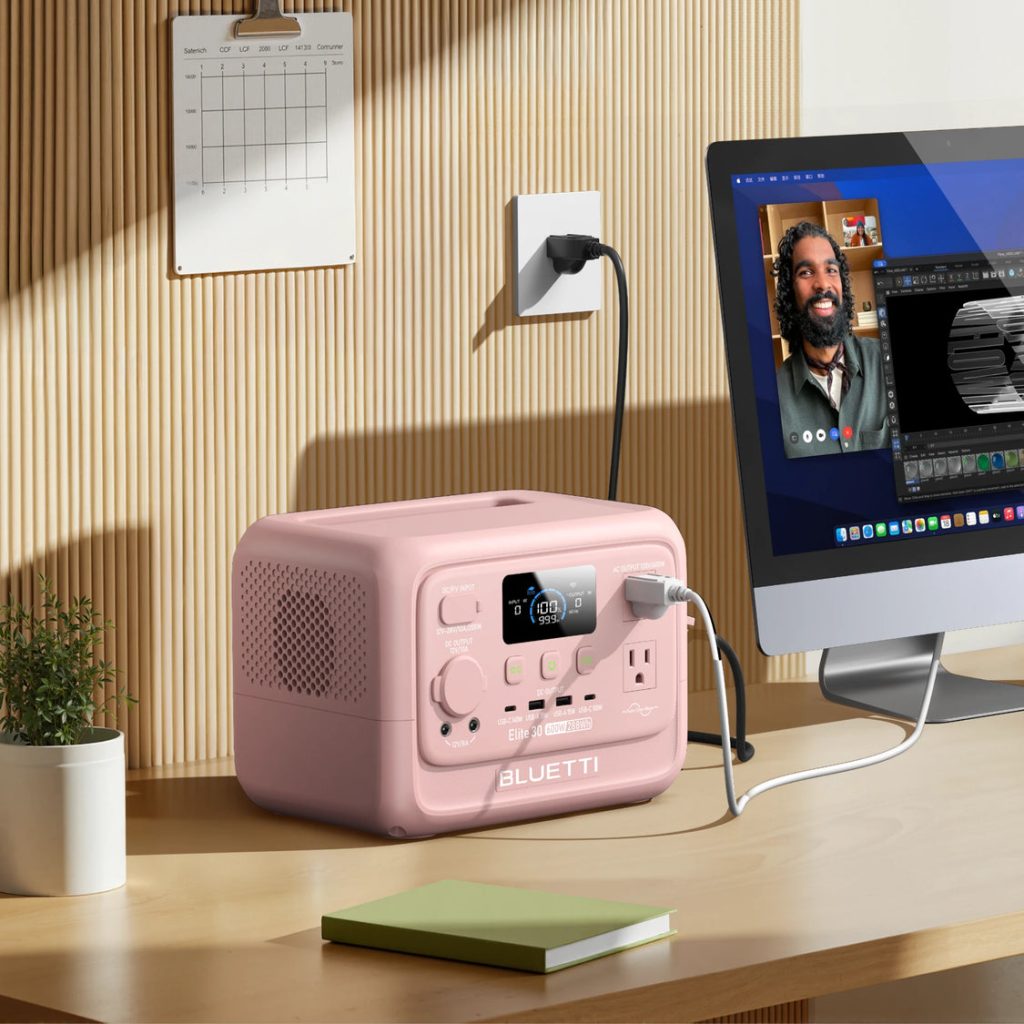 Pink Elite 30 V2 powering a desktop computer in a home office